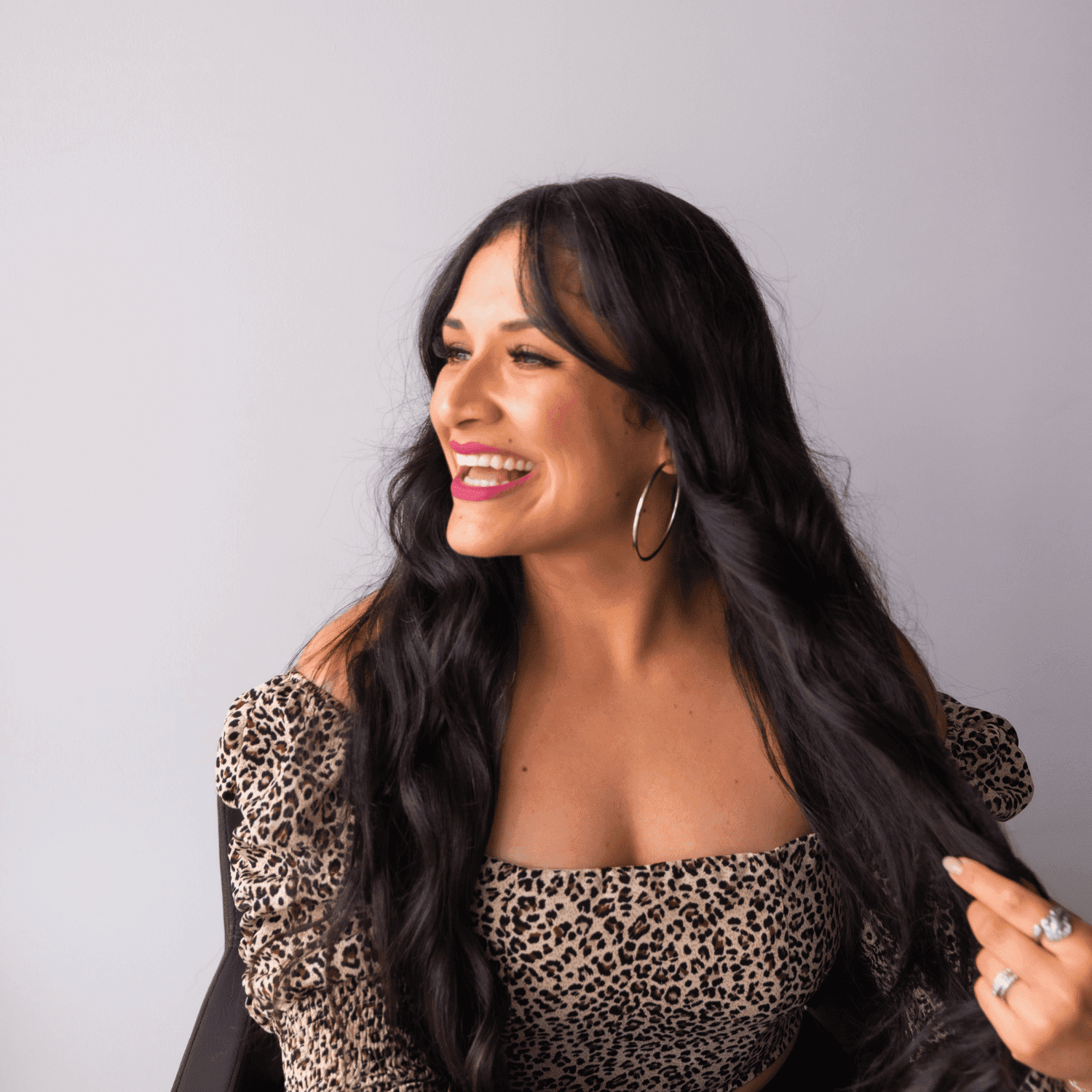 Portrait of Claudia Painter, a professional stylist at Revel Salon, showcasing their expertise and style.