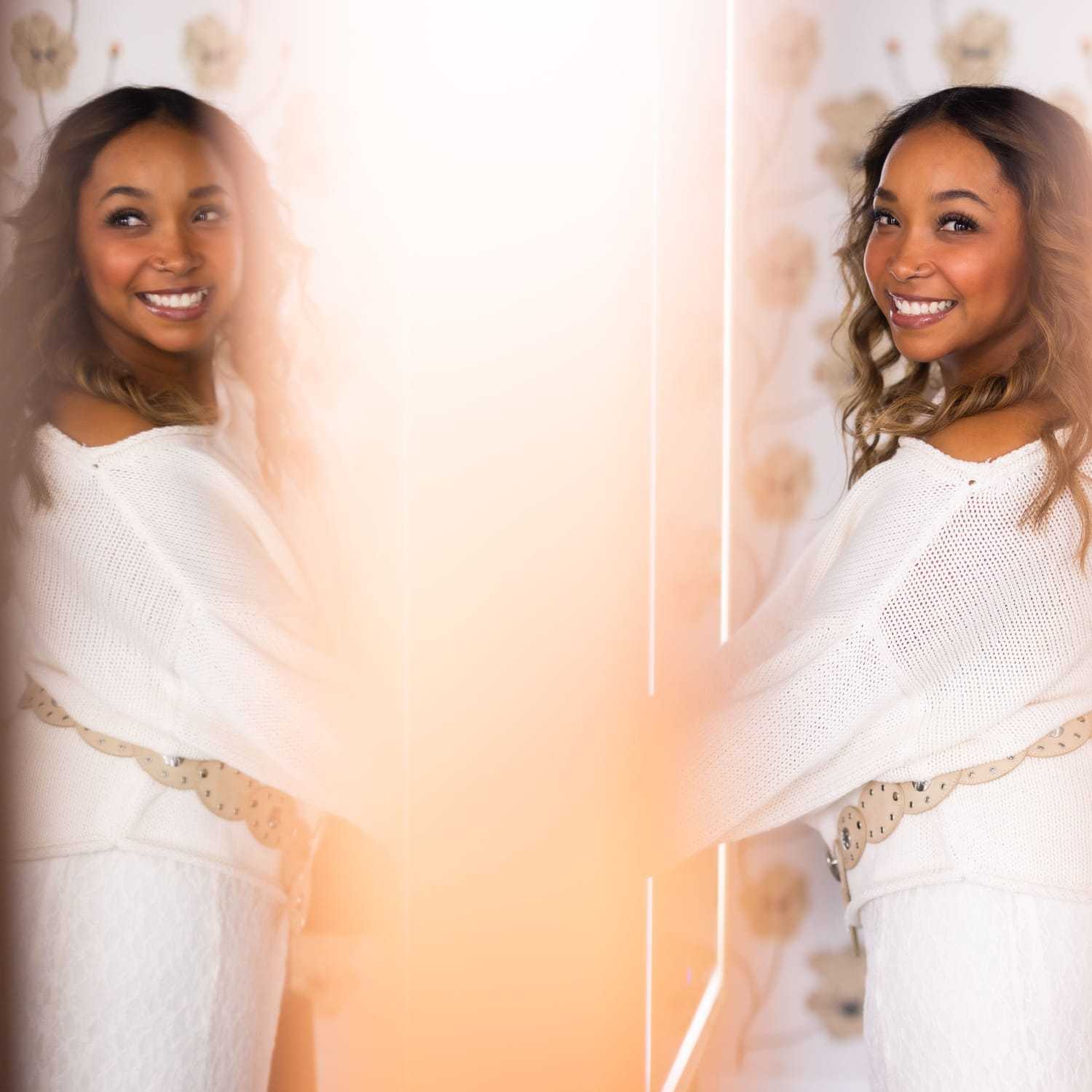 Portrait of Kiara Inez, a professional stylist at Revel Salon, showcasing their expertise and style.