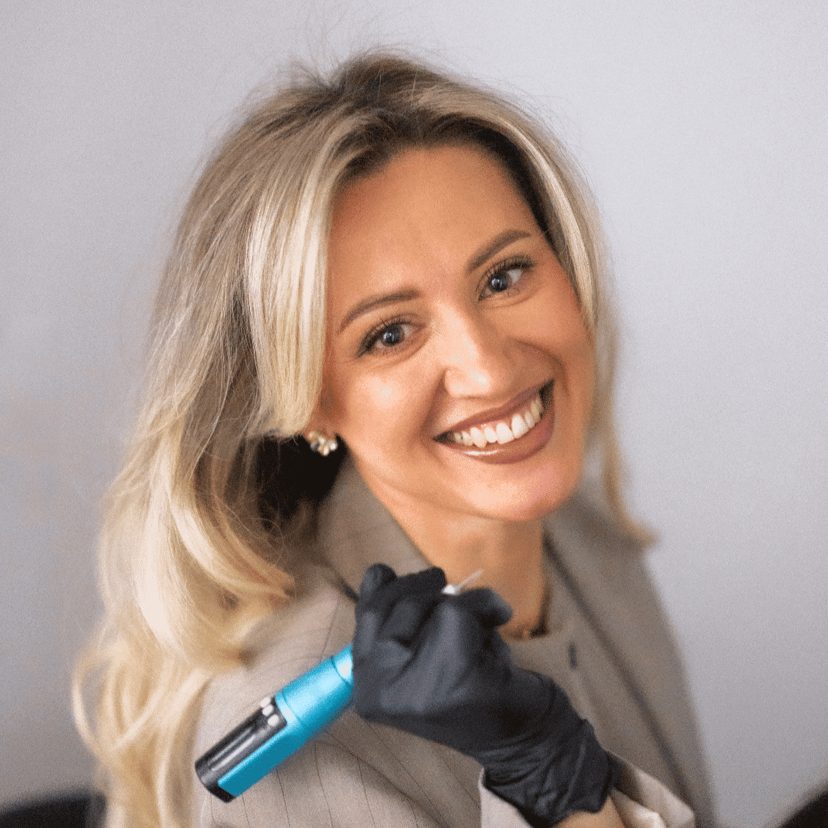 Portrait of Tina Vlasenkova, a professional stylist at Revel Salon, showcasing their expertise and style.