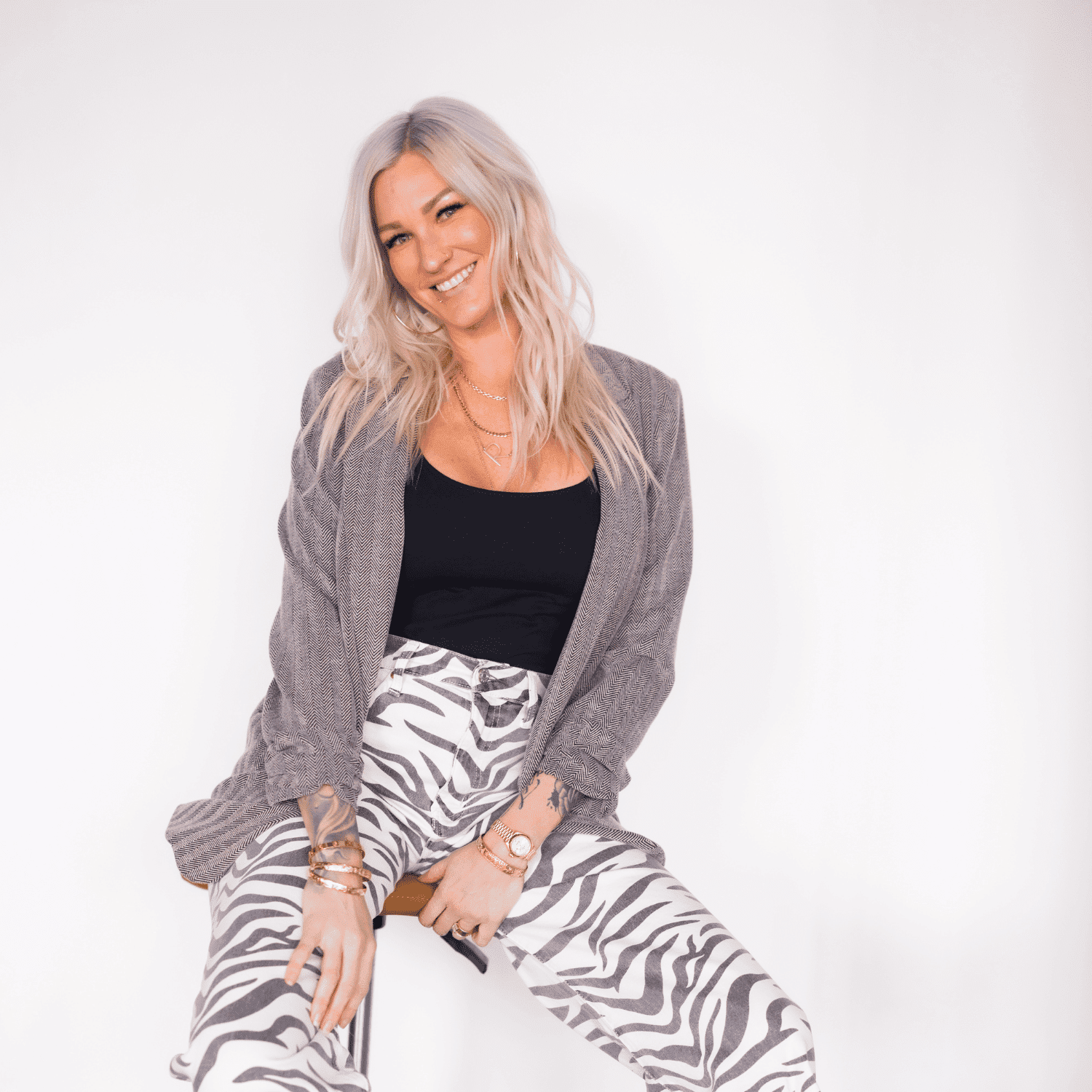 Portrait of Jamie Byer, a professional stylist at Revel Salon, showcasing their expertise and style.